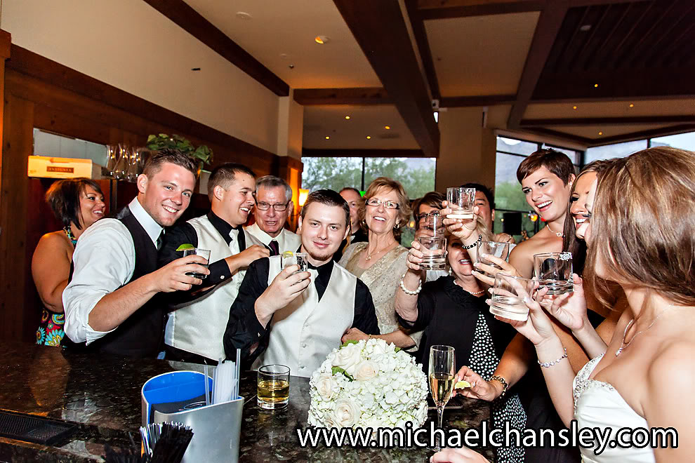 groomsmen drinking at bar